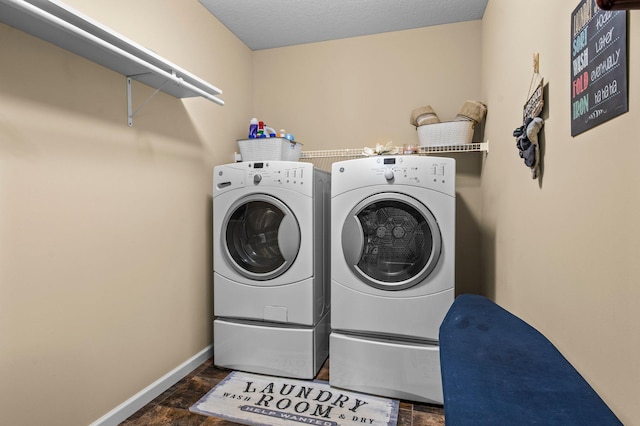 8607 Portage Ln E, Shakopee, MN 55379 - laundry area featuring washing machine and dryer, baseboards, and stone finish floors