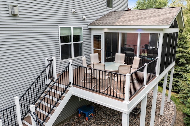 8607 Portage Ln E, Shakopee, MN 55379 - wooden deck featuring a sunroom, outdoor dining area, and stairs