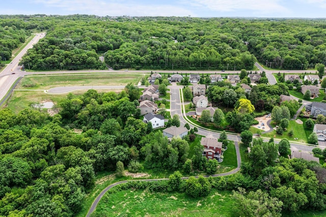 8607 Portage Ln E, Shakopee, MN 55379 - aerial view of property and surrounding area with a heavily wooded area and nearby suburban area