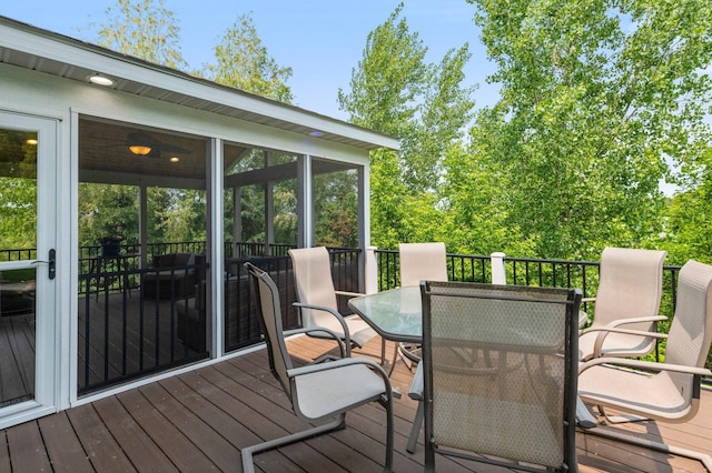 8607 Portage Ln E, Shakopee, MN 55379 - wooden terrace with outdoor dining area and a sunroom