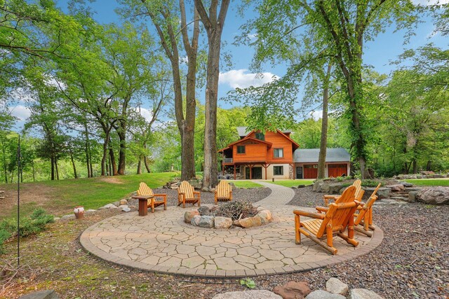9590 Woodhill Blvd, New Market Twp, MN 55044 - view of patio with an outdoor fire pit
