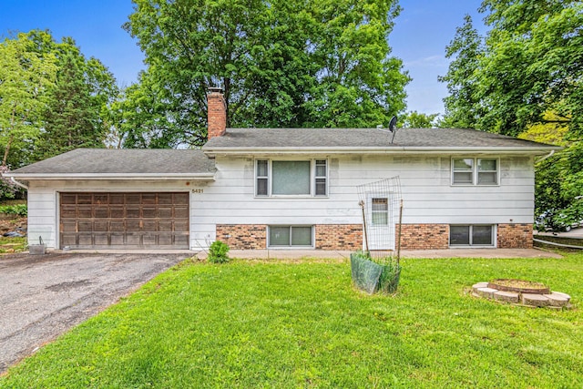 5421 Church Rd, Mound, MN 55364 - view of front of house with a garage, a chimney, a front yard, and driveway