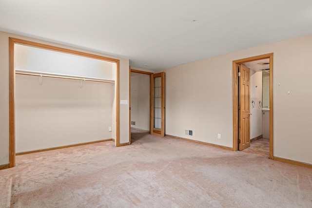 5421 Church Rd, Mound, MN 55364 - unfurnished bedroom featuring carpet flooring, baseboards, and connected bathroom