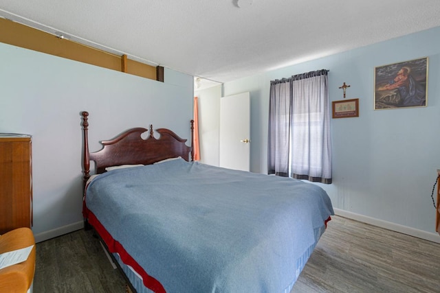 1034 8th St NW, Faribault, MN 55021 - bedroom featuring wood finished floors and baseboards