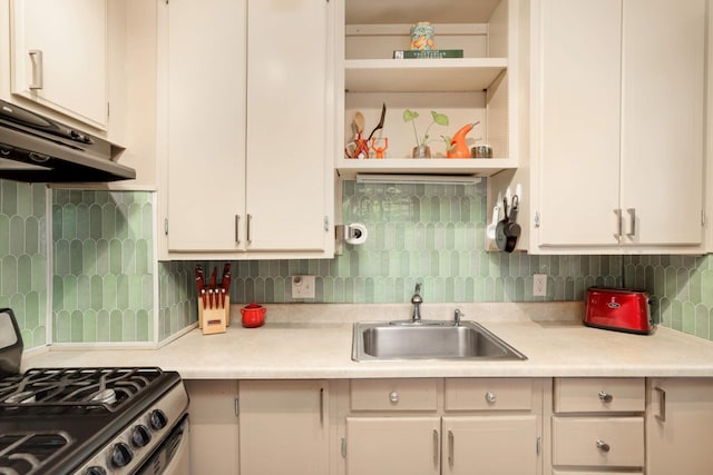246 Griggs St S, Saint Paul, MN 55105 - kitchen with stainless steel range with gas stovetop, under cabinet range hood, open shelves, and light countertops