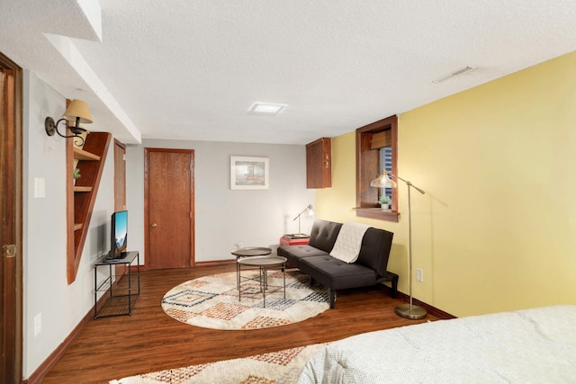 246 Griggs St S, Saint Paul, MN 55105 - bedroom featuring a textured ceiling and wood finished floors