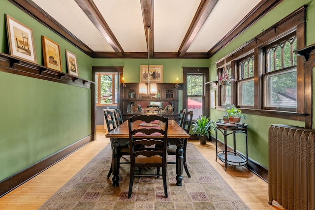 2441 Grand Ave S, Minneapolis, MN 55405 - dining room with radiator heating unit, baseboards, wood finished floors, crown molding, and beam ceiling