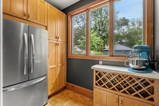 2441 Grand Ave S, Minneapolis, MN 55405 - kitchen with freestanding refrigerator, baseboards, and light countertops