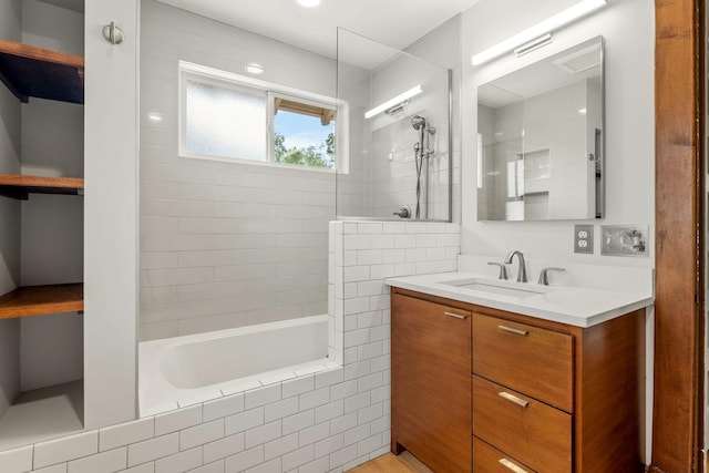 2441 Grand Ave S, Minneapolis, MN 55405 - bathroom featuring vanity and tiled shower / bath