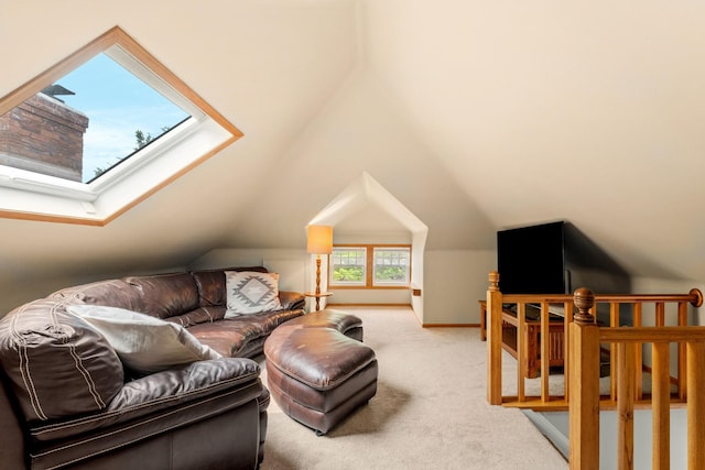 2441 Grand Ave S, Minneapolis, MN 55405 - living room featuring carpet flooring, vaulted ceiling, a skylight, and baseboards