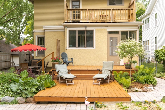2441 Grand Ave S, Minneapolis, MN 55405 - rear view of property with a balcony, a deck, and stucco siding