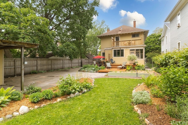 2441 Grand Ave S, Minneapolis, MN 55405 - back of property with a balcony, a wooden deck, a chimney, and a patio area