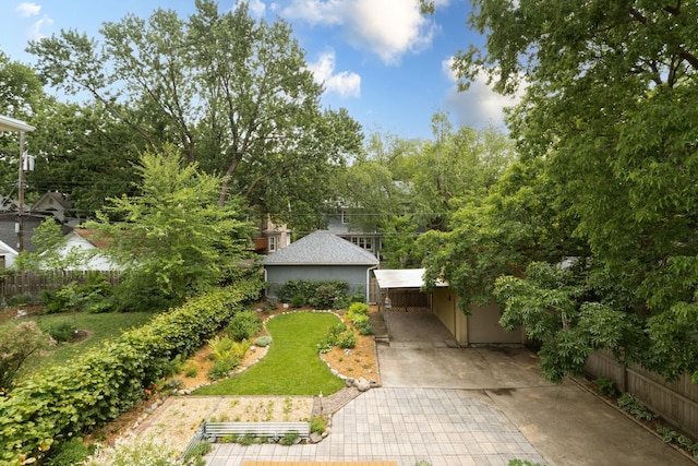 2441 Grand Ave S, Minneapolis, MN 55405 - view of yard featuring driveway and a detached carport