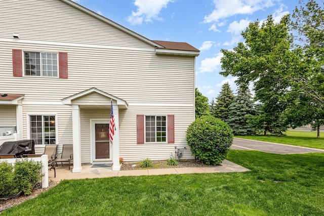 13049 Europa Trail Way N Unit H, Hugo, MN 55038 - view of front of property with a front yard and a patio