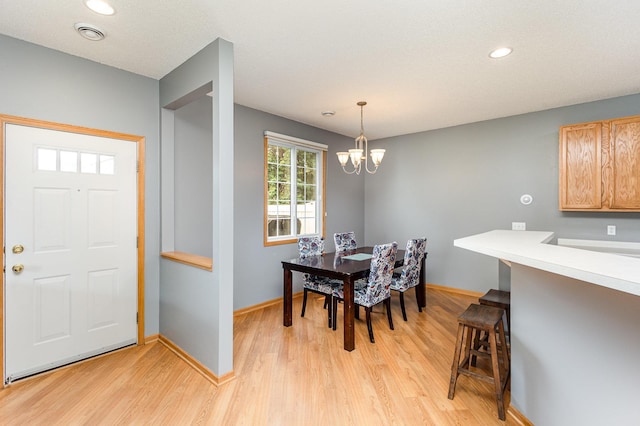 13049 Europa Trail Way N Unit H, Hugo, MN 55038 - dining area featuring light wood-type flooring, a chandelier, and recessed lighting