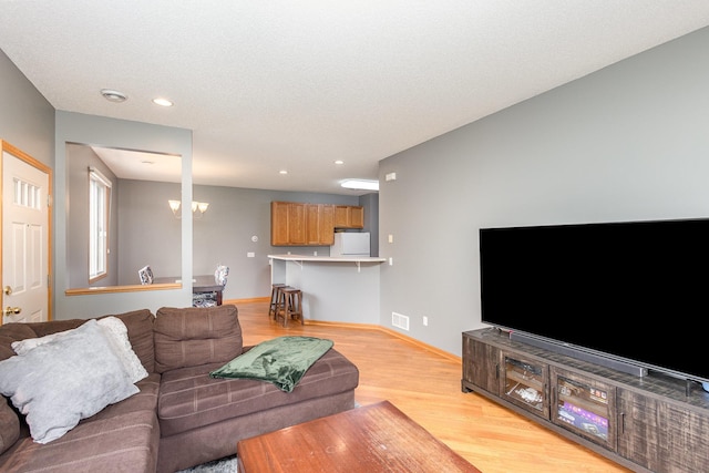 13049 Europa Trail Way N Unit H, Hugo, MN 55038 - living room with light wood-style flooring and recessed lighting