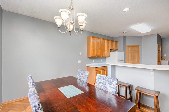 13049 Europa Trail Way N Unit H, Hugo, MN 55038 - unfurnished dining area with a textured ceiling, a chandelier, light wood-type flooring, and recessed lighting