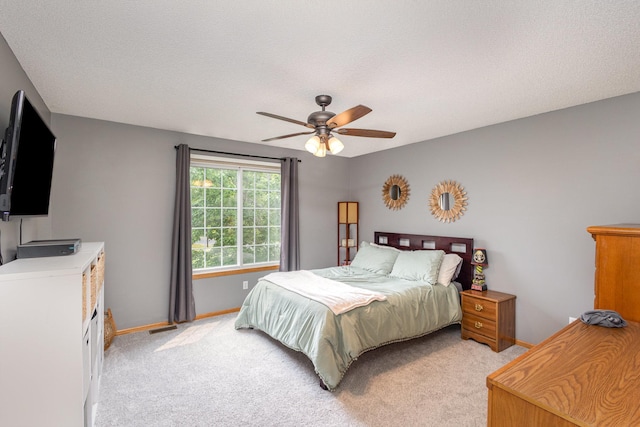 13049 Europa Trail Way N Unit H, Hugo, MN 55038 - bedroom with light colored carpet, ceiling fan, and a textured ceiling
