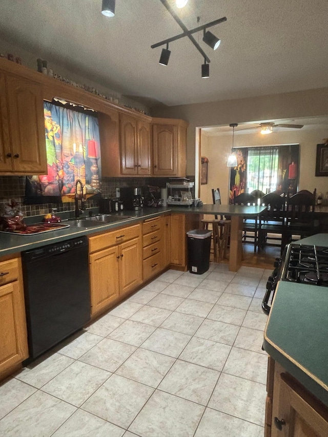 613 13th St SW, Willmar, MN 56201 - kitchen with dishwasher, backsplash, a sink, a textured ceiling, and light tile patterned floors