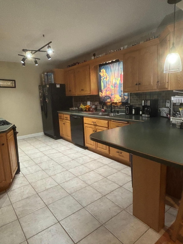 613 13th St SW, Willmar, MN 56201 - kitchen featuring black appliances, dark countertops, decorative backsplash, a sink, and a textured ceiling