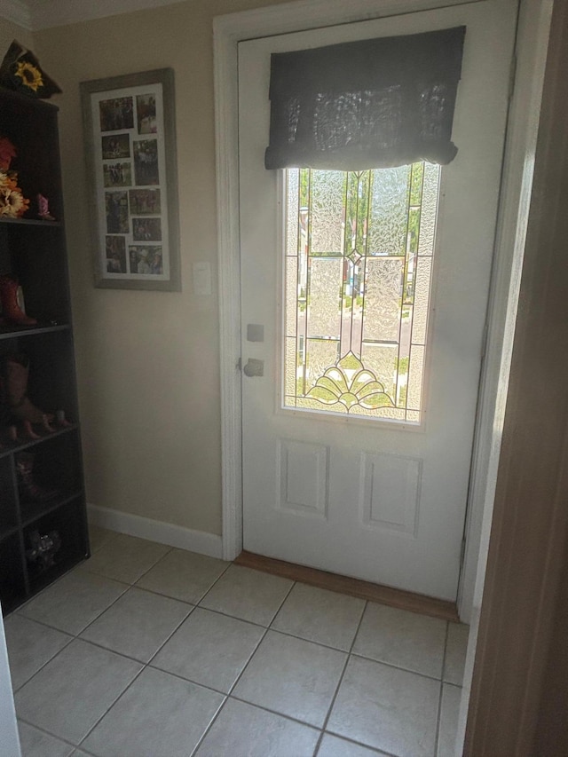 613 13th St SW, Willmar, MN 56201 - doorway featuring light tile patterned floors, plenty of natural light, and baseboards