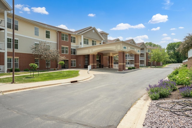 1880 3rd Ave NW Unit 202, Rochester, MN 55901 - view of front facade featuring brick siding