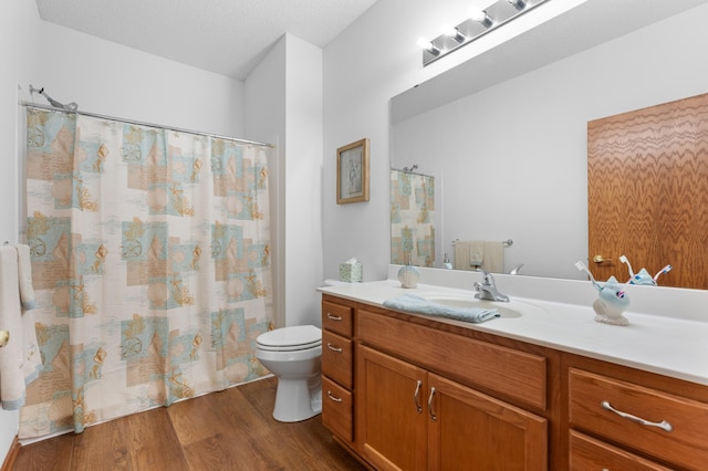 1880 3rd Ave NW Unit 202, Rochester, MN 55901 - full bathroom featuring vanity, toilet, wood finished floors, and a shower with shower curtain