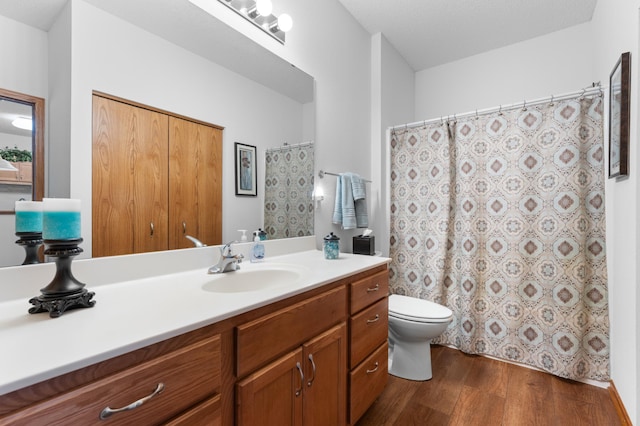 1880 3rd Ave NW Unit 202, Rochester, MN 55901 - full bath featuring wood finished floors, vanity, toilet, and curtained shower
