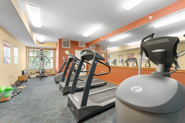 1880 3rd Ave NW Unit 202, Rochester, MN 55901 - exercise room with a textured ceiling, carpet, and baseboards