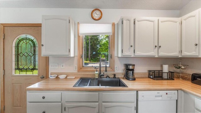 13956 Hardy Lake Rd SW, Pillager, MN 56473 - kitchen featuring white dishwasher, a sink, and white cabinetry