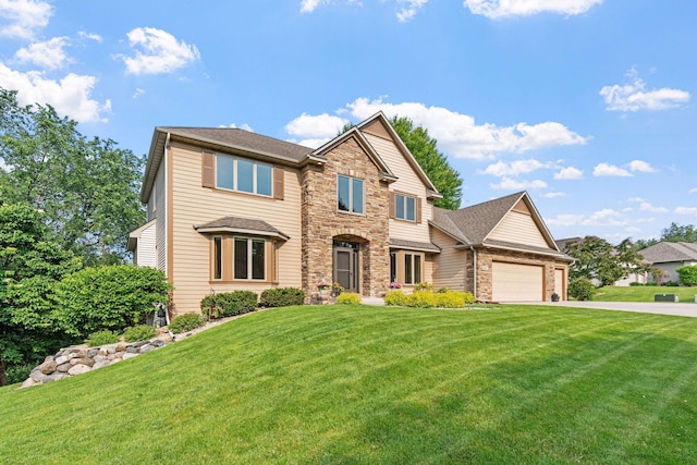 6617 Orchid Ln N, Maple Grove, MN 55311 - view of front of house featuring an attached garage, concrete driveway, a front yard, and stone siding