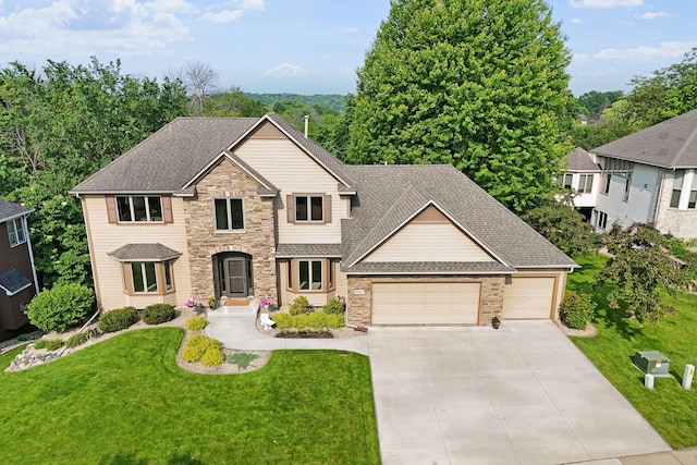 6617 Orchid Ln N, Maple Grove, MN 55311 - view of front of home featuring an attached garage, stone siding, concrete driveway, a front yard, and a shingled roof
