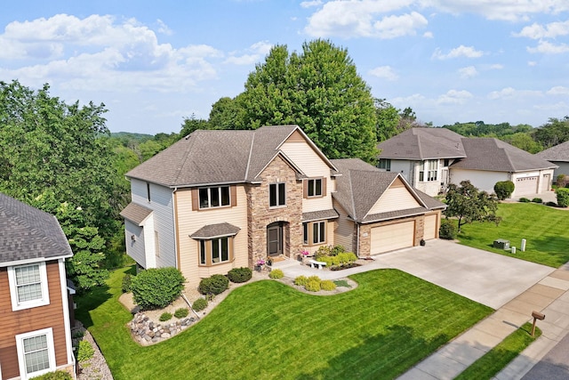 6617 Orchid Ln N, Maple Grove, MN 55311 - traditional-style home with an attached garage, driveway, a front yard, a shingled roof, and stone siding