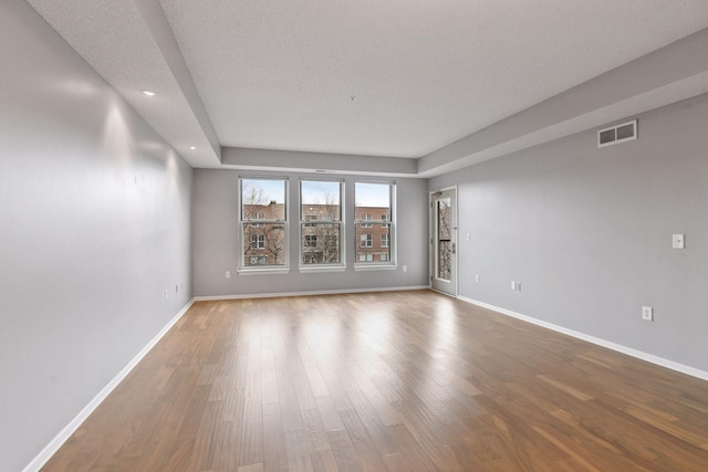 560 2nd St Unit 302, Minneapolis, MN 55401 - unfurnished room with baseboards, wood finished floors, and recessed lighting