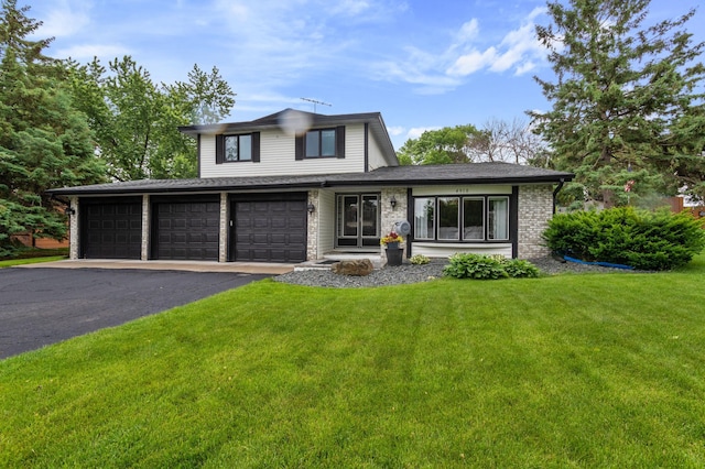 4910 Upper 148th Ct, Apple Valley, MN 55124 - view of front facade with a front lawn, asphalt driveway, an attached garage, and brick siding
