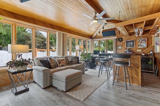 4910 Upper 148th Ct, Apple Valley, MN 55124 - living room featuring wooden walls, wooden ceiling, a ceiling fan, a bar, and wood finished floors