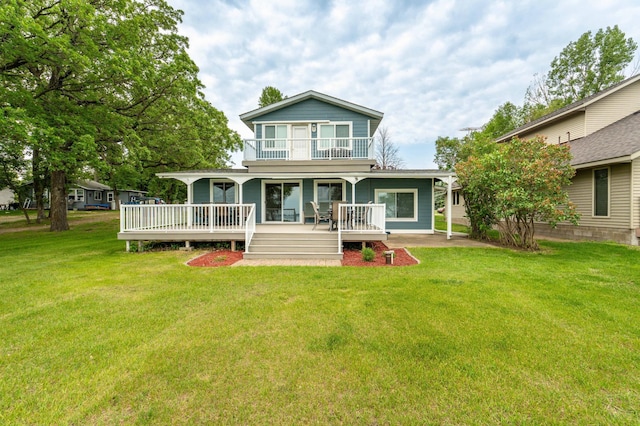 27326 Cloverleaf Ln, Everts Twp, MN 56515 - back of property featuring a balcony, a yard, and a porch