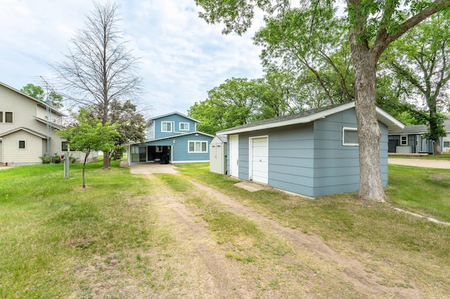 27326 Cloverleaf Ln, Everts Twp, MN 56515 - view of green lawn with an outbuilding and driveway