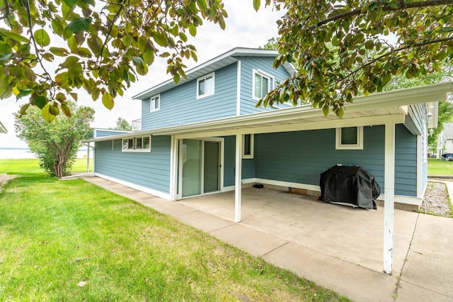 27326 Cloverleaf Ln, Everts Twp, MN 56515 - back of house featuring a yard, a patio area, and an attached carport