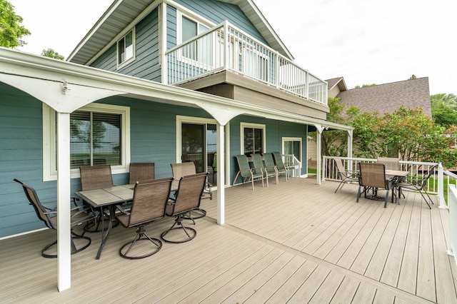 27326 Cloverleaf Ln, Everts Twp, MN 56515 - wooden deck featuring outdoor dining space