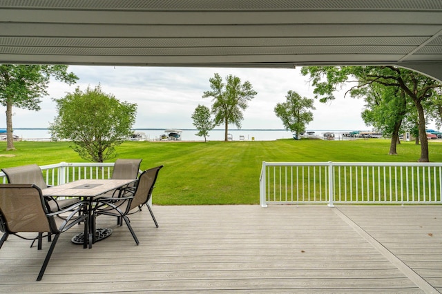 27326 Cloverleaf Ln, Everts Twp, MN 56515 - wooden deck featuring outdoor dining area, a lawn, and a water view