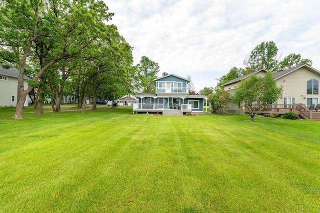 27326 Cloverleaf Ln, Everts Twp, MN 56515 - back of house featuring a yard and a porch