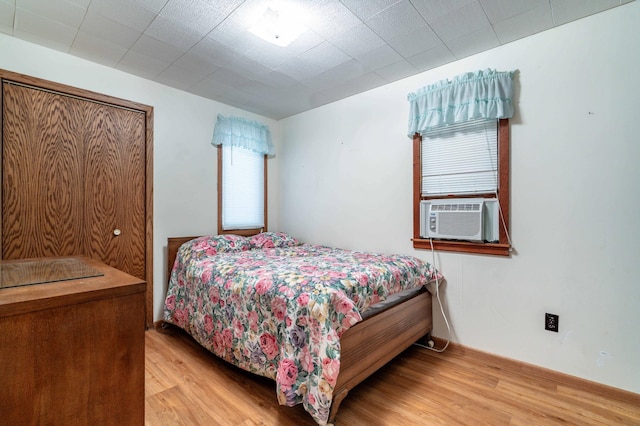 27326 Cloverleaf Ln, Everts Twp, MN 56515 - bedroom with light wood-type flooring and cooling unit