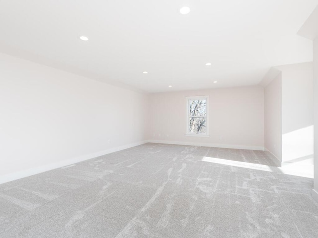 7010 Oak Ridge Rd, Corcoran, MN 55340 - spare room featuring light carpet, recessed lighting, and baseboards