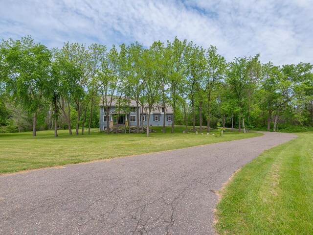 7010 Oak Ridge Rd, Corcoran, MN 55340 - colonial-style house with a front lawn