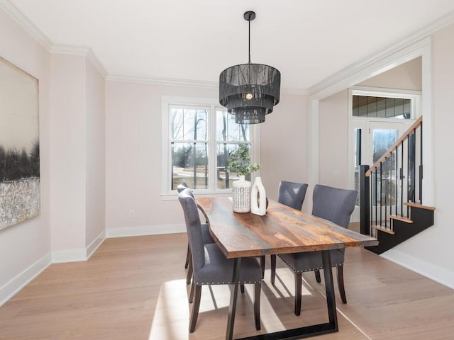 7010 Oak Ridge Rd, Corcoran, MN 55340 - dining area with light wood finished floors, crown molding, baseboards, stairway, and a chandelier