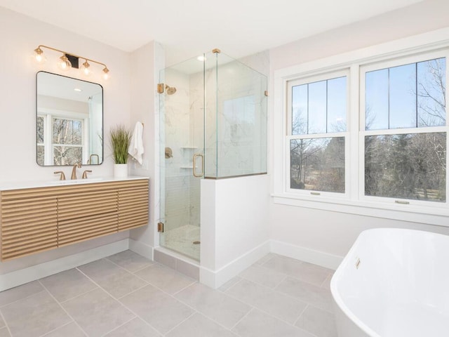 7010 Oak Ridge Rd, Corcoran, MN 55340 - full bathroom featuring a soaking tub, vanity, a stall shower, and tile patterned floors