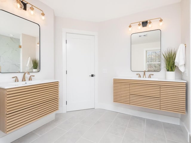 7010 Oak Ridge Rd, Corcoran, MN 55340 - bathroom featuring two vanities, tile patterned floors, and baseboards