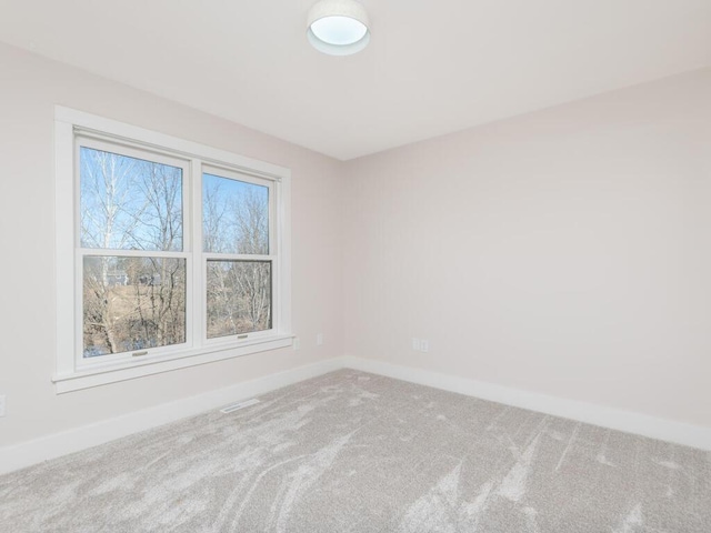 7010 Oak Ridge Rd, Corcoran, MN 55340 - carpeted empty room featuring baseboards