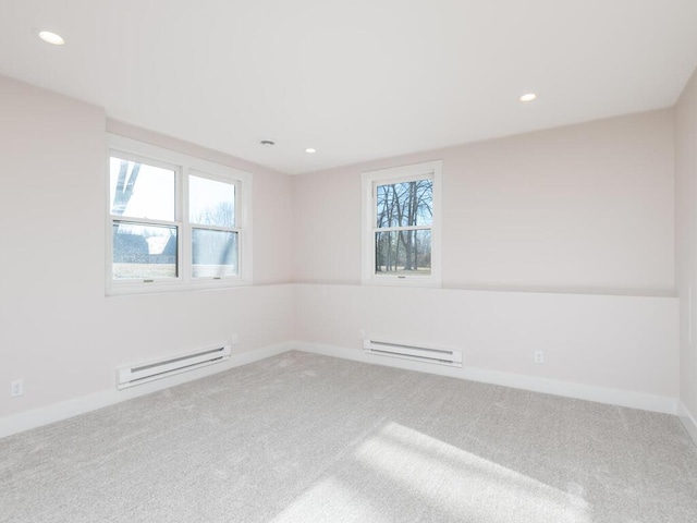 7010 Oak Ridge Rd, Corcoran, MN 55340 - spare room featuring a baseboard heating unit, carpet floors, recessed lighting, and baseboards